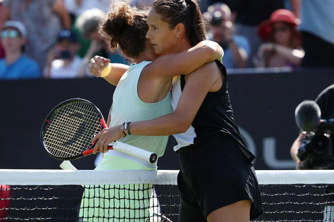 Daria Kasatkina hugs Italy's Jasmine Paolini after winning their semi-final match.