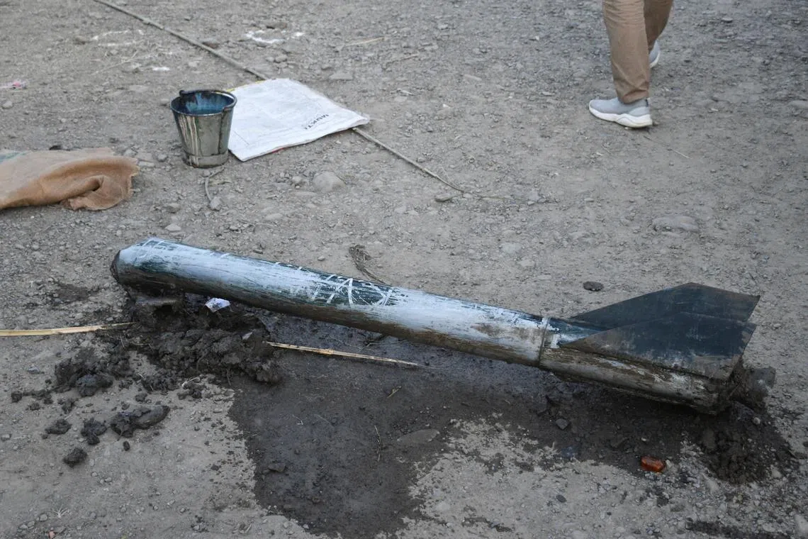 Remains of a missile lie on the ground in Moirang in India's Manipur state on Sept 6, 2024. 