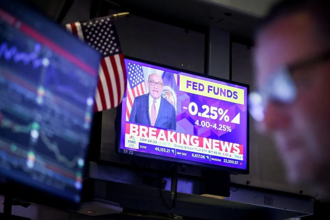 A television at the New York Stock Exchange broadcasting the Federal Reserve's decision to cut rates, on Sept 17.