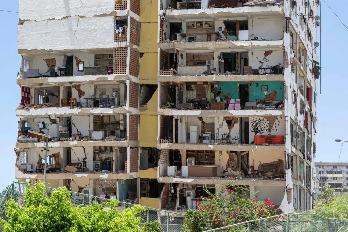 This photograph shows a damaged building in Playa Grande neighborhood, La Guaira state, Venezuela, on July 1, 2026, following the June 24 twin earthquakes. Tens of thousands of people urgently need food and shelter in Venezuela due to the devastation from two huge earthquakes that killed more than 1,700 and injured 5,000, the UN said on June 30, 2026, as doctors warned of potential outbreaks of disease. (Photo by Miguel MEDINA / POOL / AFP)