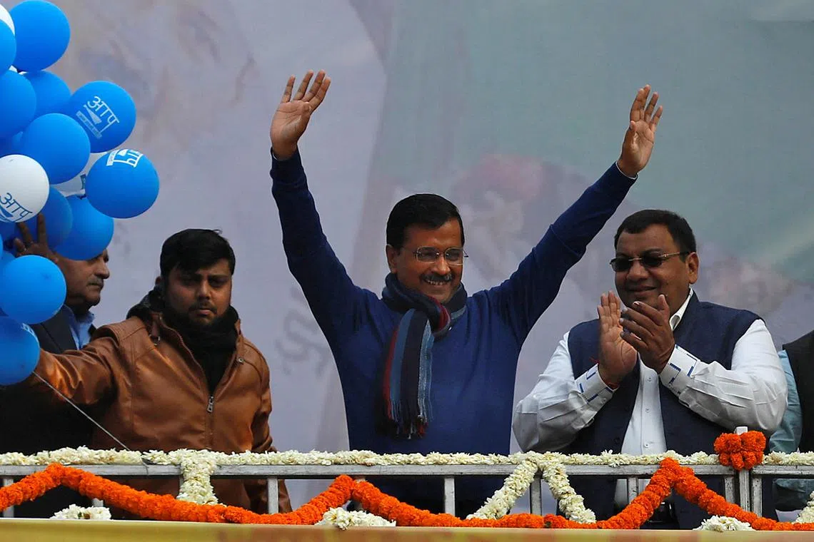 Leader of Aam Aadmi Party Arvind Kejriwal waves to supporters during party celebrations in New Delhi, on Feb 11, 2020.