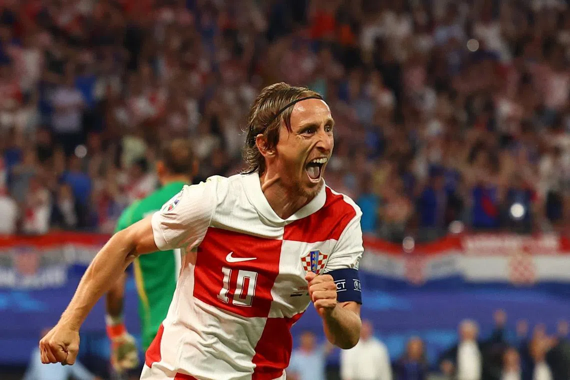 Soccer Football - Euro 2024 - Group B - Croatia v Italy - Leipzig Stadium, Leipzig, Germany - June 24, 2024  Croatia's Luka Modric celebrates scoring their first goal REUTERS/Lisi Niesner