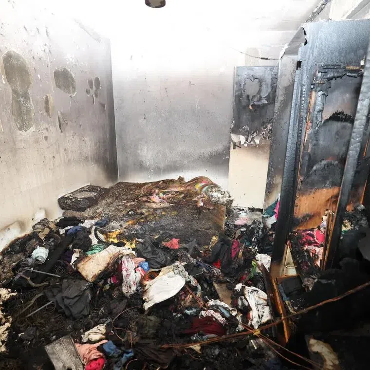 The bedroom of a fourth-floor unit in Block 223A Sumang Lane in Punggol caught fire on May 1, leaving its contents charred.