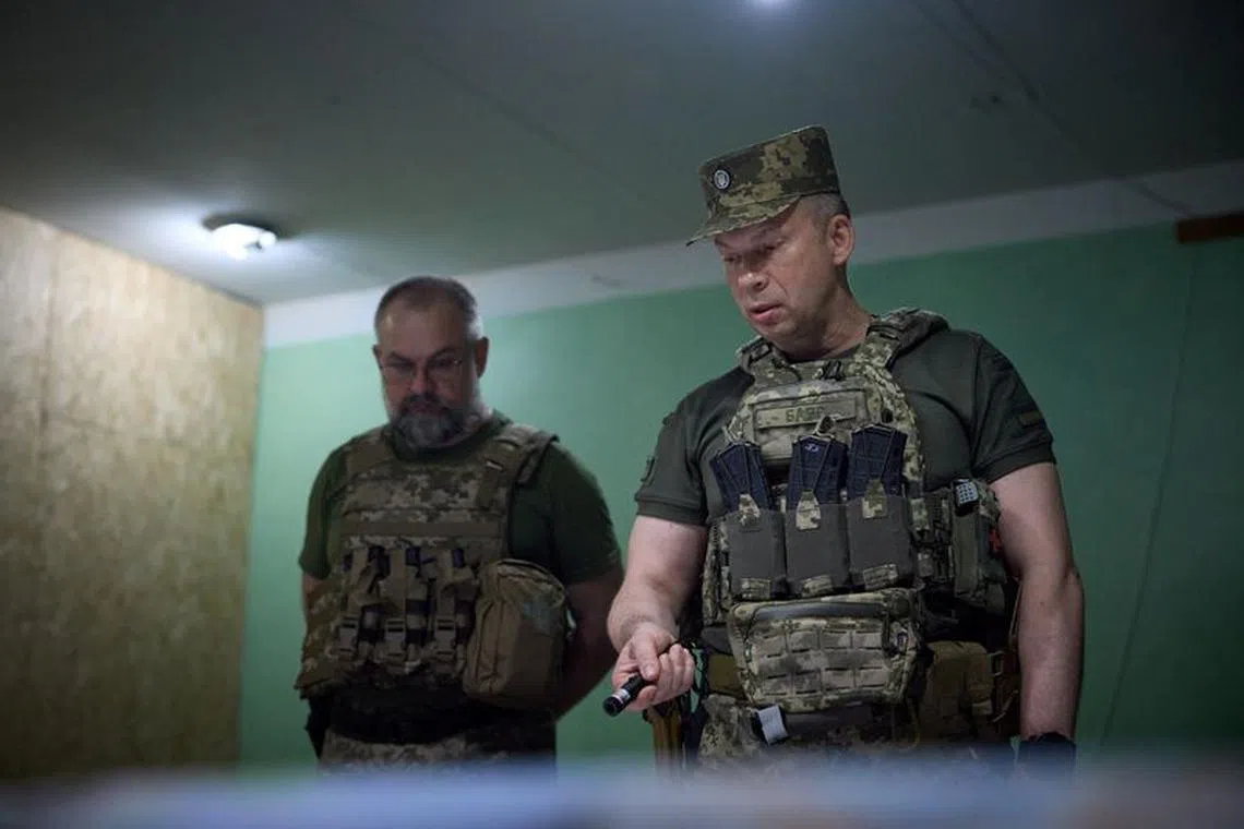 Commander of the Ground Forces colonel general Oleksandr Syrskyi reports Ukraine's President Volodymyr Zelenskiy at a position near the front line, amid Russia's attack on Ukraine, in Donetsk region, Ukraine June 26, 2023. Ukrainian Presidential Press Service/Handout via REUTERS/File Photo