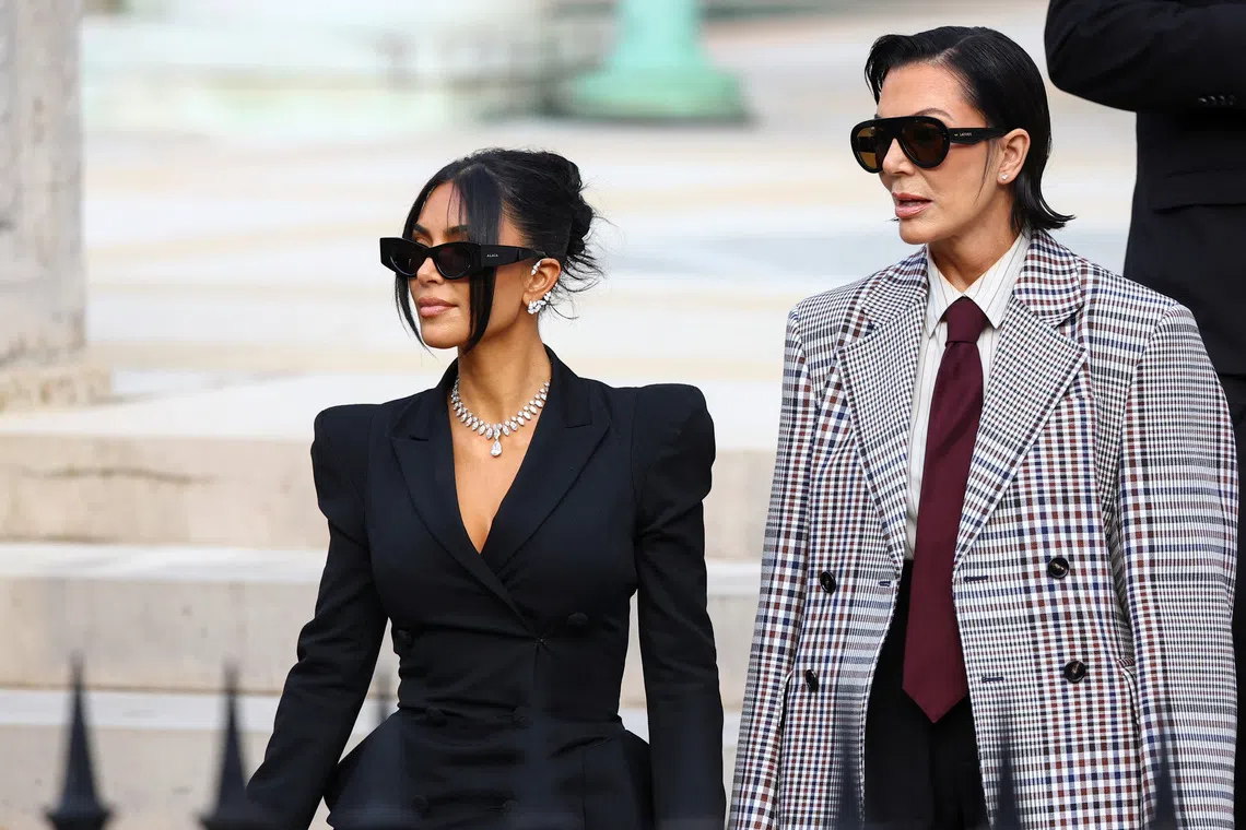 Kim Kardashian (left), accompanied by her mother and manager, Kris Jenner, leaving the courthouse after a trial in Paris, on May 13, 2025.
