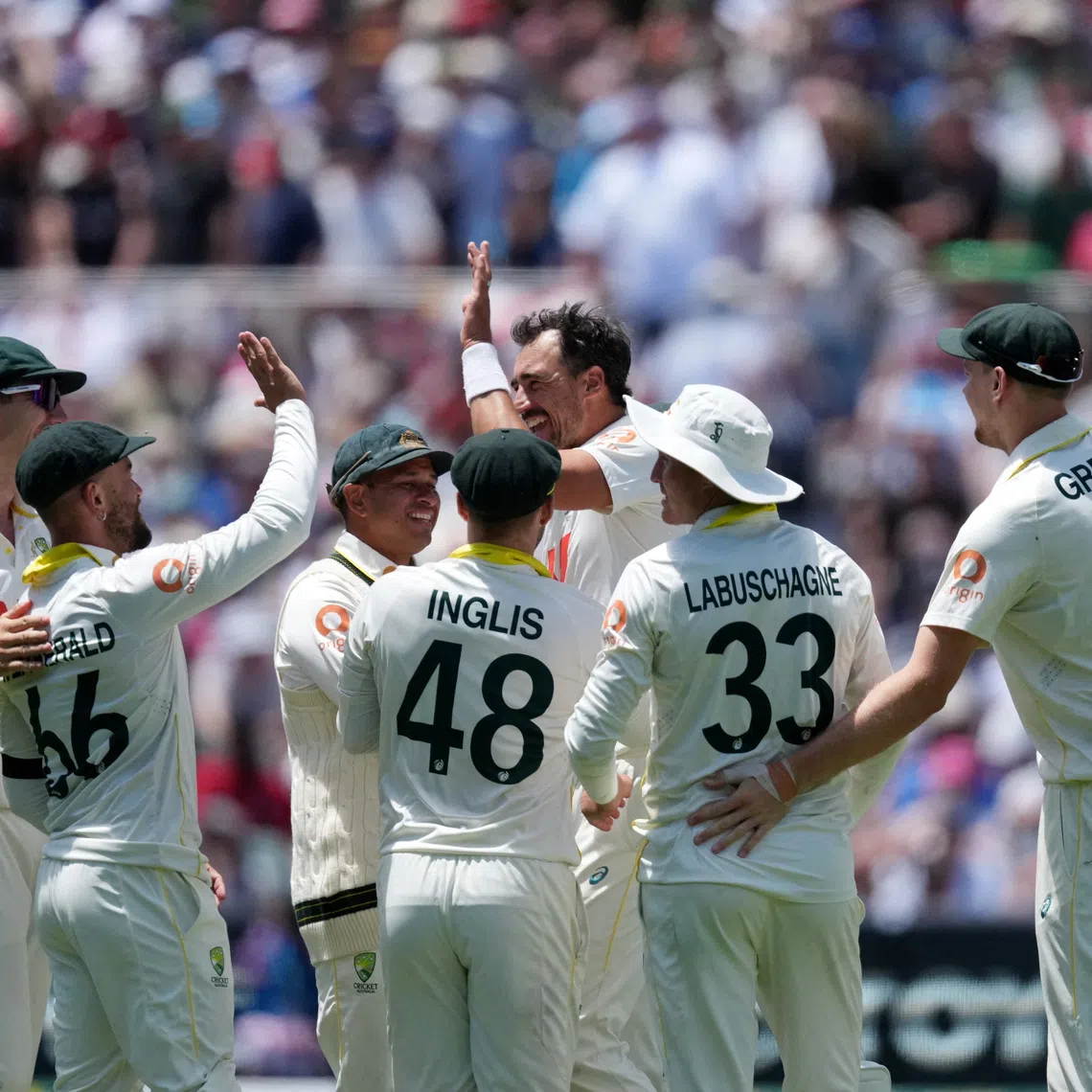 Cricket - The Ashes - Australia v England - Third Test - Adelaide Oval, Adelaide, Australia - December 21, 2025 Australia's Mitchell Starc celebrates with teammates after taking the wicket of England's Jofra Archer REUTERS/Asanka Brendon Ratnayake