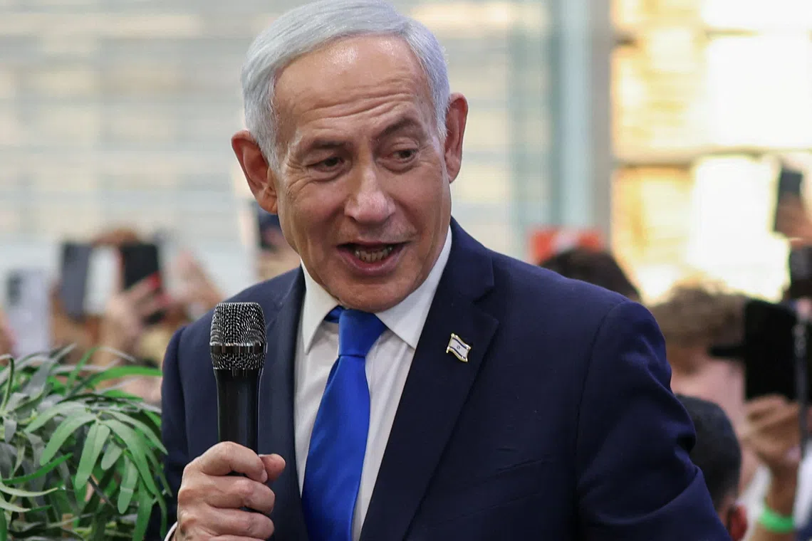 Israeli Prime Minister Benjamin Netanyahu meets members of the public, ahead of Israel’s national election, in Yokneam Illit, Israel, on Oct 18.