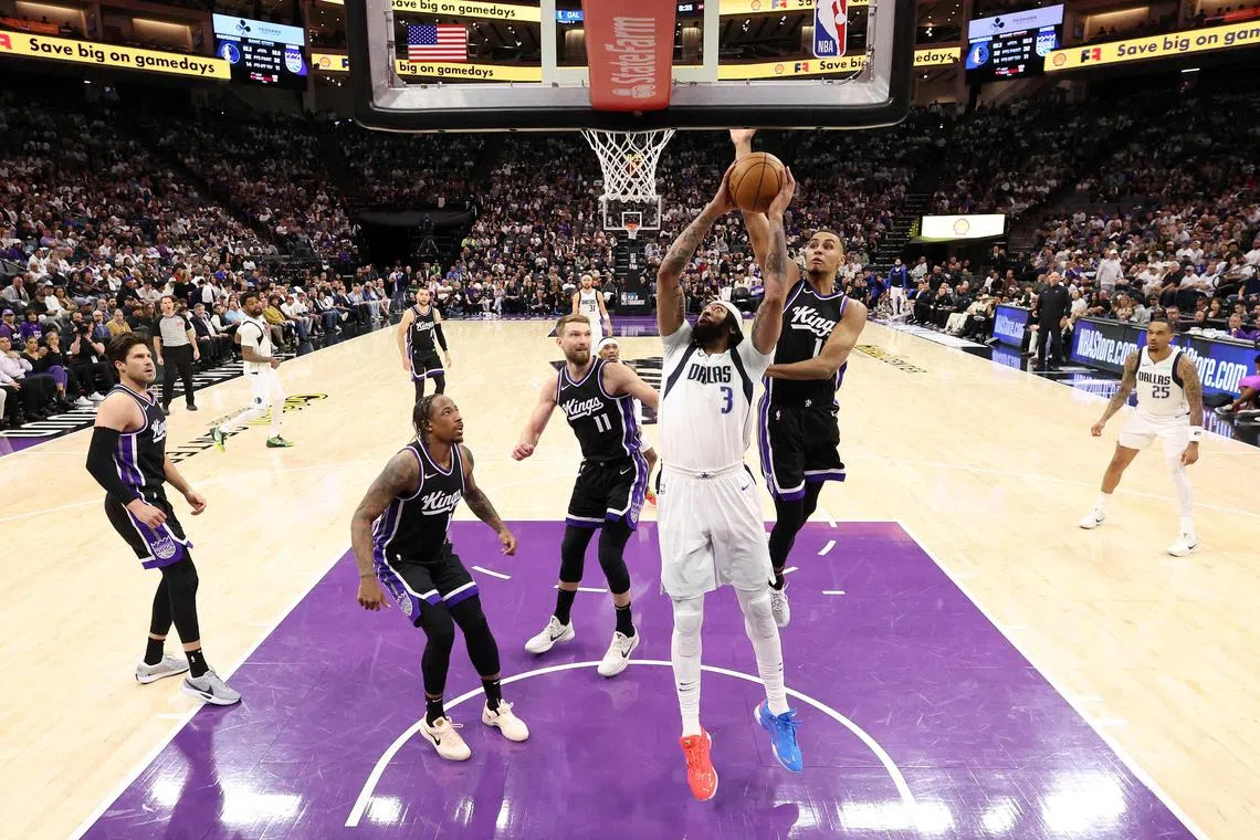 Anthony Davis of the Dallas Mavericks goes up for a shot on Keegan Murray of the Sacramento Kings during the second half of the NBA play-in game at Golden 1 Centre.