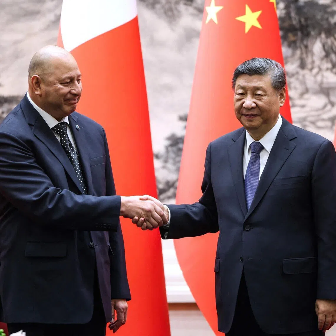 Tonga’s King Tupou VI and China’s President Xi Jinping shaking hands after a signing ceremony at the Great Hall of the People in Beijing on Nov 25, 2025.