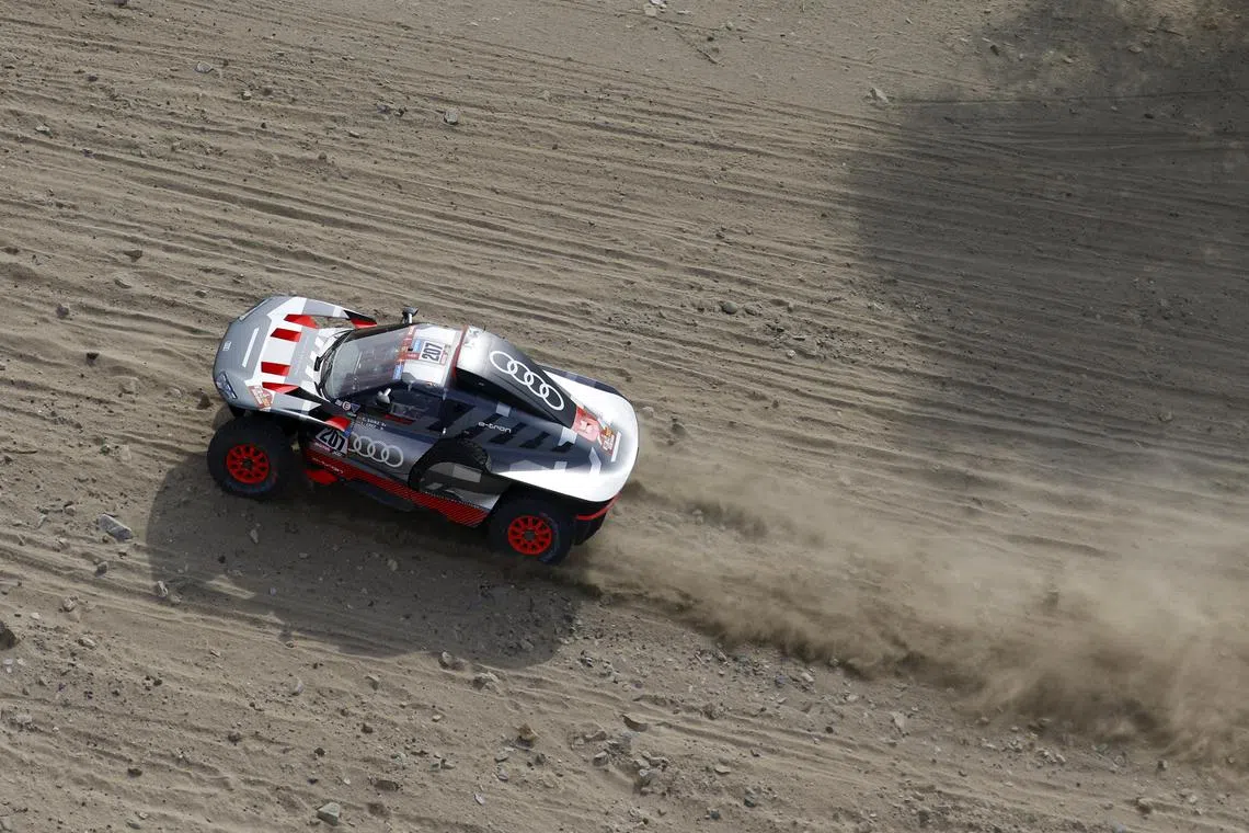 Team Audi Sport's Carlos Sainz and co-driver Lucas Cruz in action during stage 1  of the Dakar Rally. He leads Sebastien Loeb by 10 seconds.