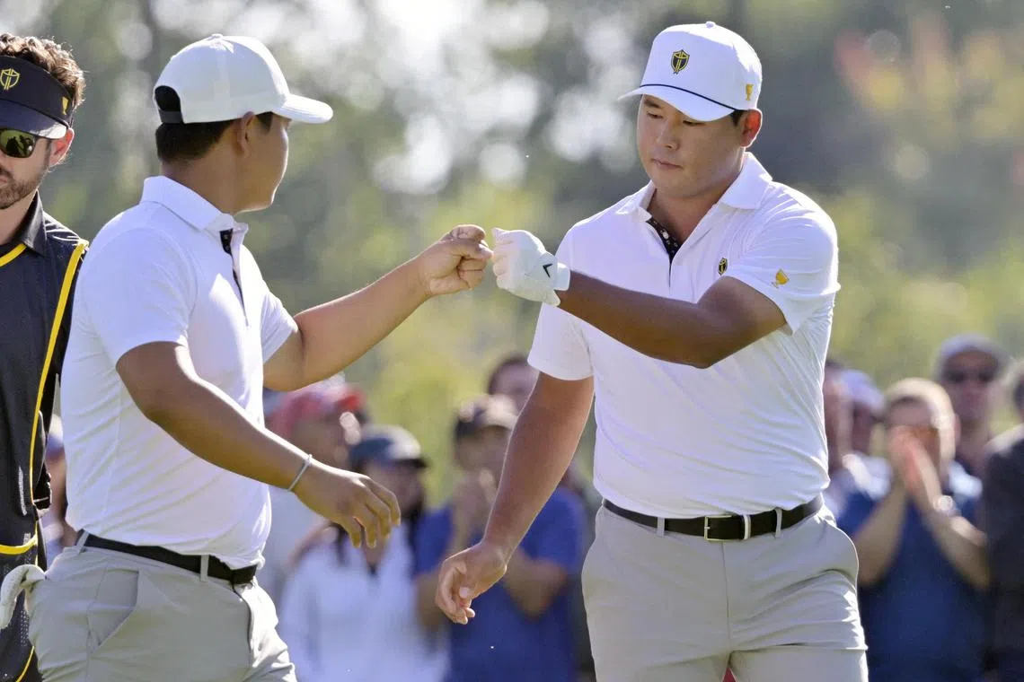 Kim Si-woo (left) of the International Team and Tom Kim of the International team on the first hole during the foursomes (alternate) round of The Presidents Cup golf tournament.
