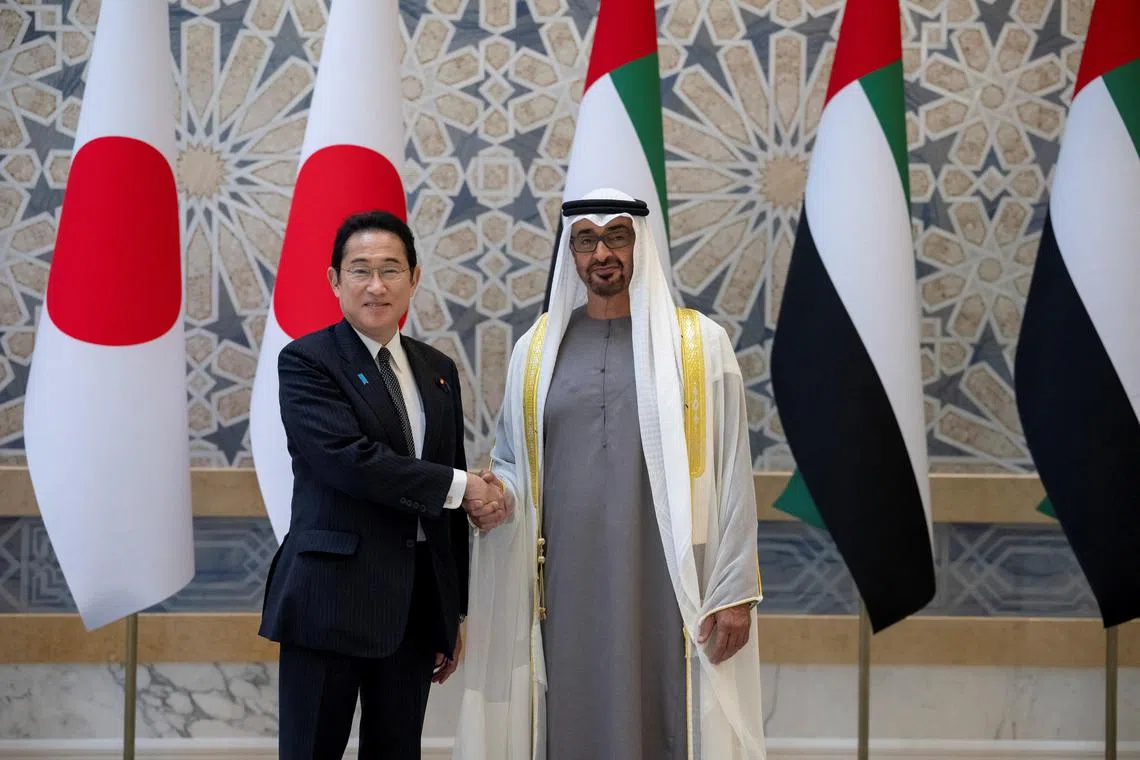 UAE President Sheikh Mohamed bin Zayed Al Nahyan (right) welcomes Japanese PM Fumio Kishida in Abu Dhabi, on July 17.