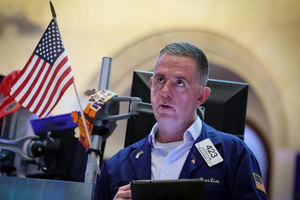 A trader works on the floor of the New York Stock Exchange, in New York City.  