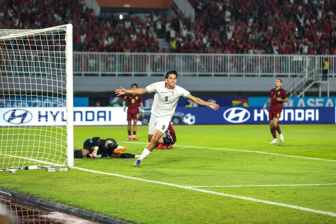 Indonesian national Football player Mitchell Lee Baker celebrates after successfully scoring a goal against the Cambodia national team in ASEAN Hyundai Cup 2026 match.
