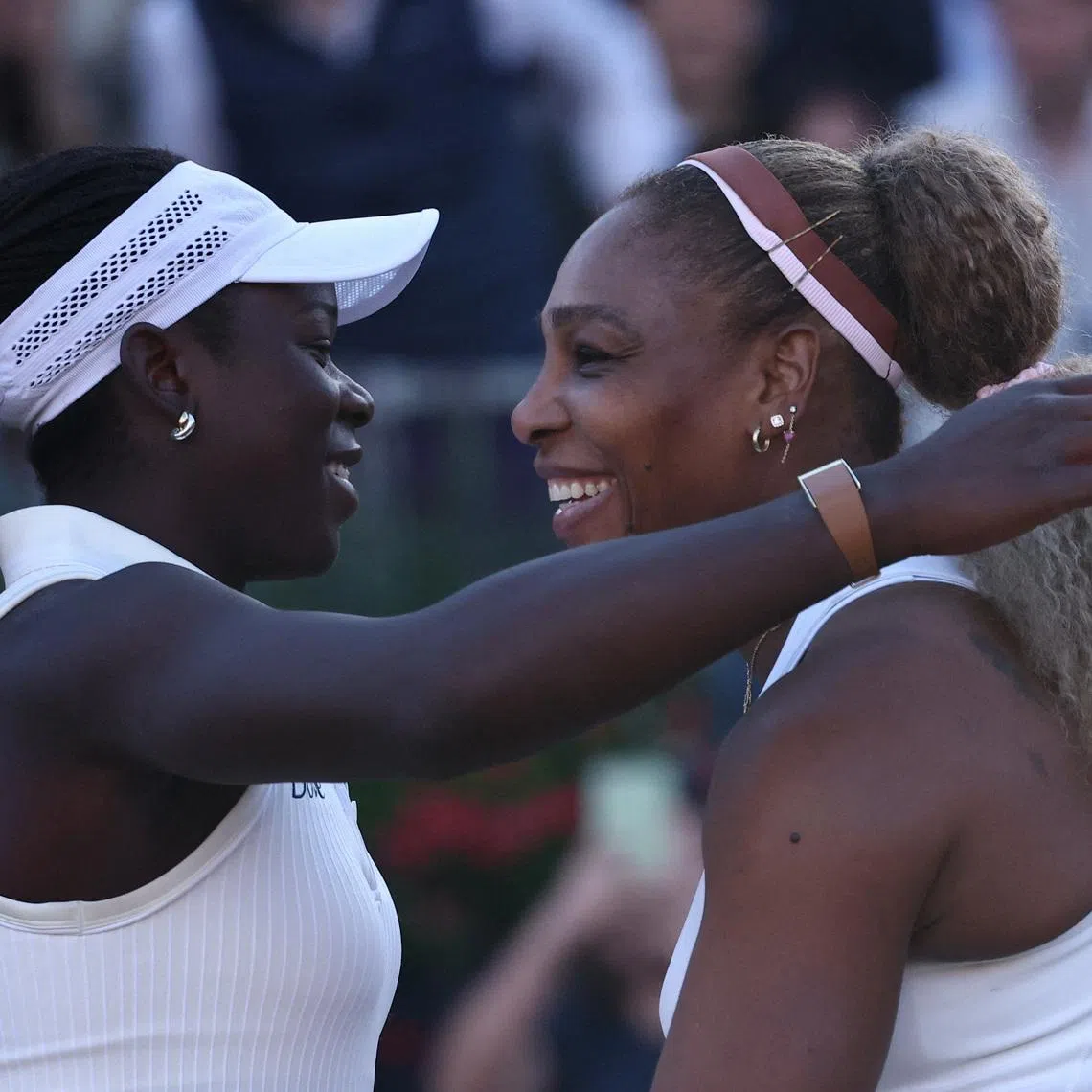 Tennis - Queen's Club Championships - Queen's Club, London, Britain - June 9, 2026 Serena Williams of the U.S. and Canada's Victoria Mboko celebrate after winning their round of 16 doubles match against Nicole Melichar-Martinez of the U.S. and New Zealand's Erin Routliffe REUTERS/Toby Melville