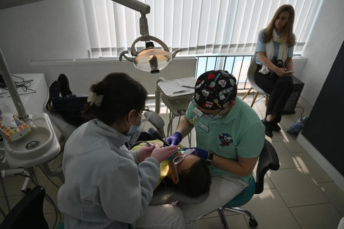 Some Ukrainian refugees head home – for dental work