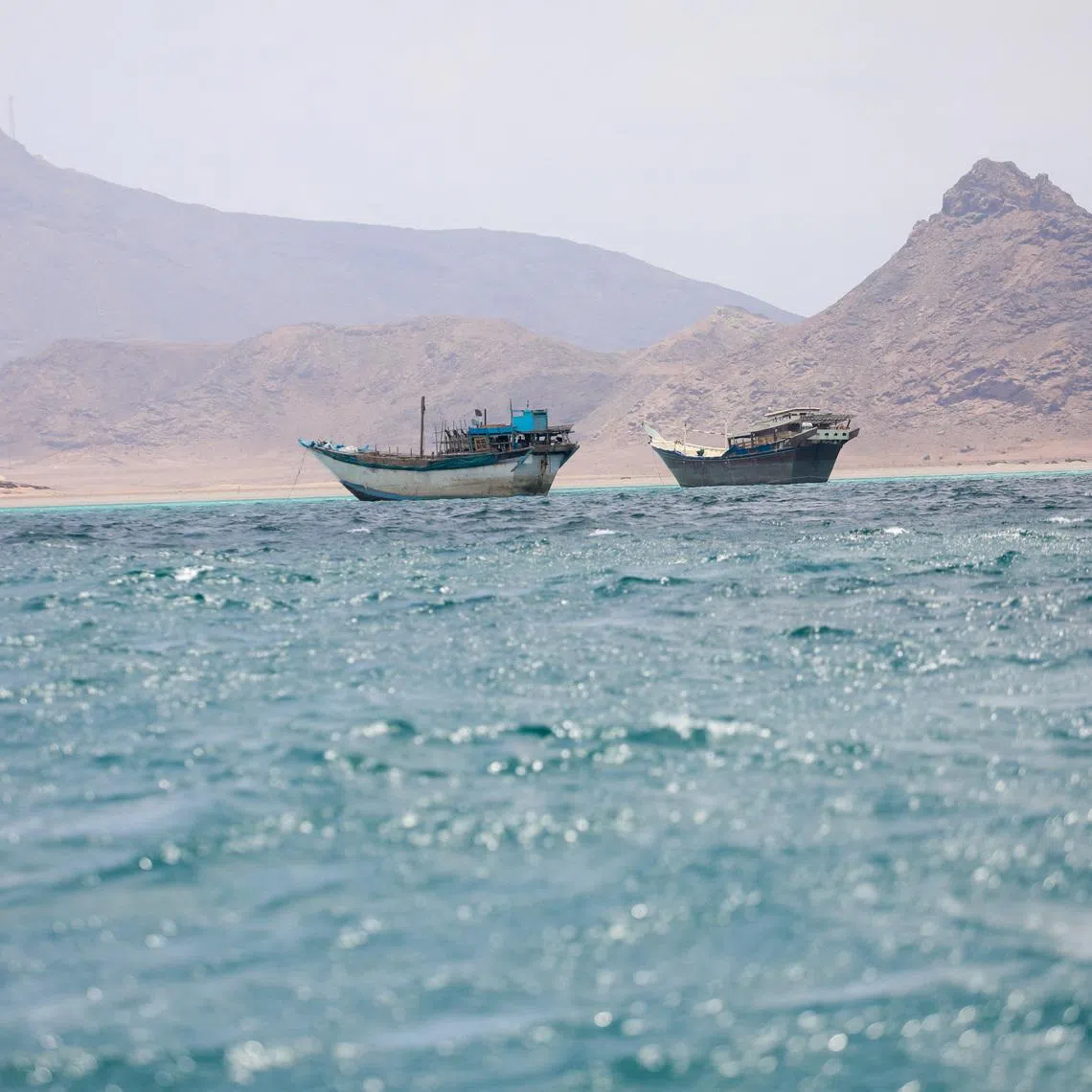 FILE PHOTO: Boats float near the coast of Bab el-Mandeb, Yemen April 2, 2026. REUTERS/File Photo