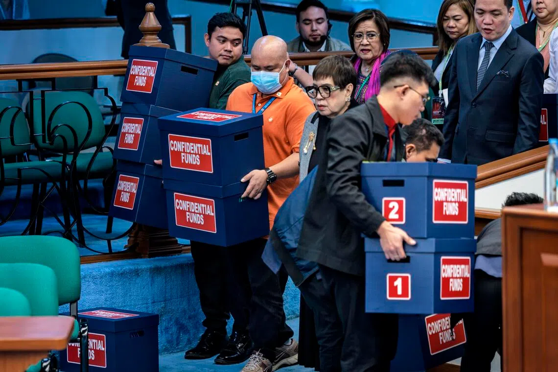 epa13147915 Workers carry boxes labelled 'confidential funds' containing documents to be presented the impeachment trial of Filipino Vice President Sara Duterte at the Philippine Senate in Pasay, Metro Manila, Philippines, 03 August 2026. The impeachment trial of Philippine Vice President Sara Duterte is underway in the Senate, testing both her political future and the country’s fragile ruling alliance after months of bitter infighting with President Ferdinand Marcos Jr.  EPA/EZRA ACAYAN / POOL