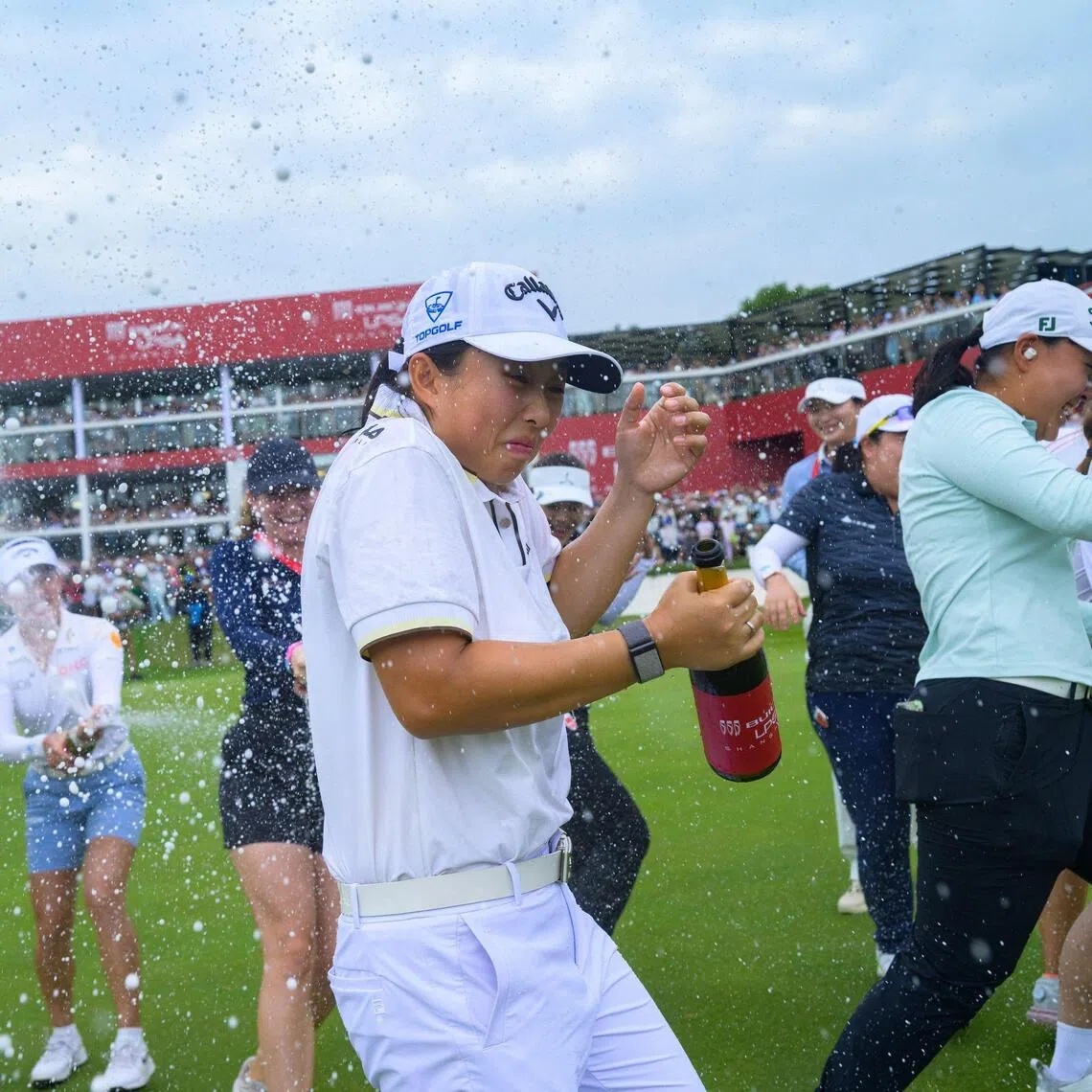 China’s Yin Ruoning being doused in champagne by her rivals after winning the LPGA Shanghai event on Oct 18.