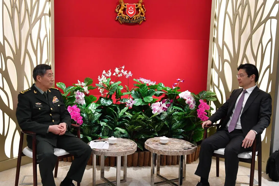 China State Councillor and Defence Minister Li Shangfu (left) calling on Acting Prime Minister Lawrence Wong at The Treasury on the sidelines of the 20th Shangri-La Dialogue.