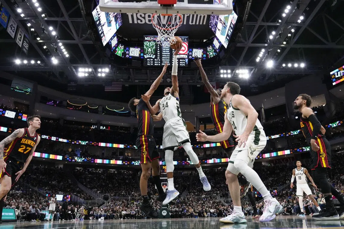 Milwaukee Bucks forward Giannis Antetokounmpo shoots during the third quarter against the Atlanta Hawks at Fiserv Forum.