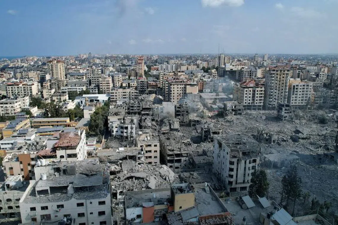 A view shows houses and buildings destroyed by Israeli strikes in Gaza City, October 10, 2023. REUTERS/Shadi Tabatibi