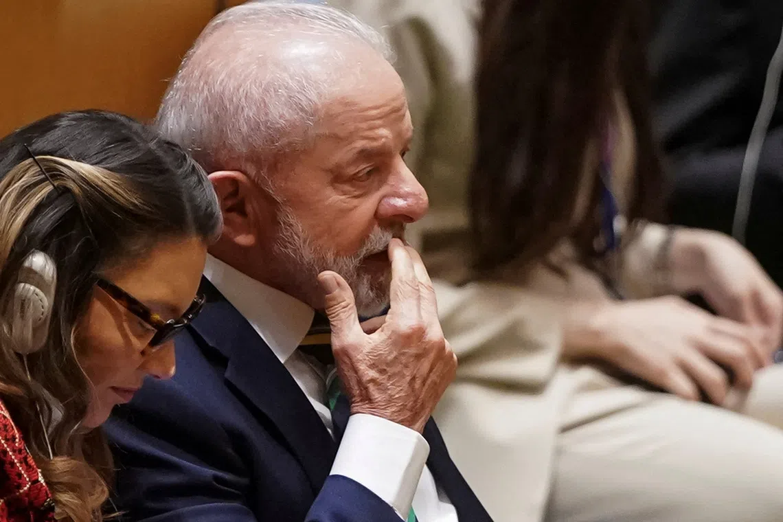 FILE PHOTO: Brazil's President Luiz Inacio Lula da Silva reacts while listening to U.S. President Donald Trump's (not pictured) speech at the 80th United Nations General Assembly, in New York City, New York, U.S., September 23, 2025. REUTERS/Al Drago/File Photo