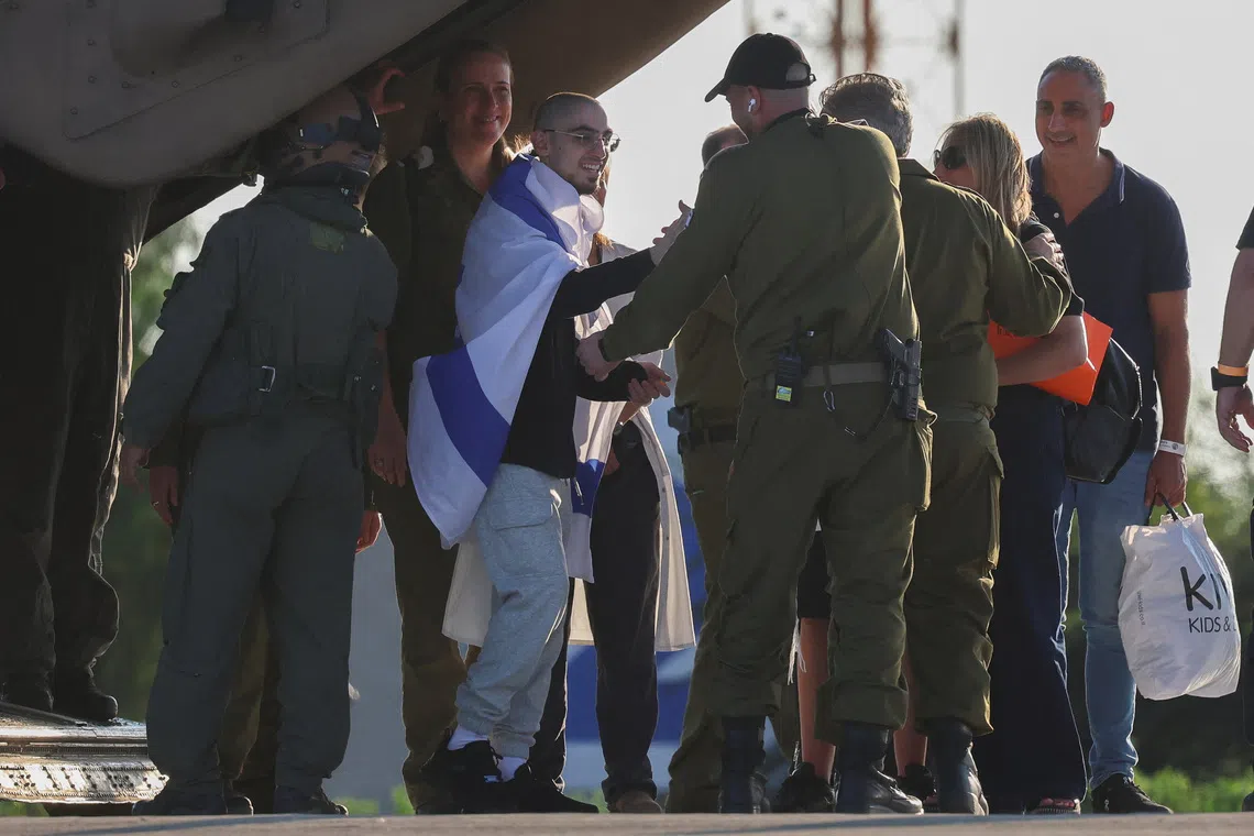 Rom Braslavski, a released hostage who was kidnapped during the deadly October 7, 2023 attack by Hamas and taken to Gaza, arrives at Sheba Medical Center, amid a ceasefire between Israel and Hamas in Gaza, in Ramat Gan, Israel October 13, 2025. REUTERS/Hannah McKay