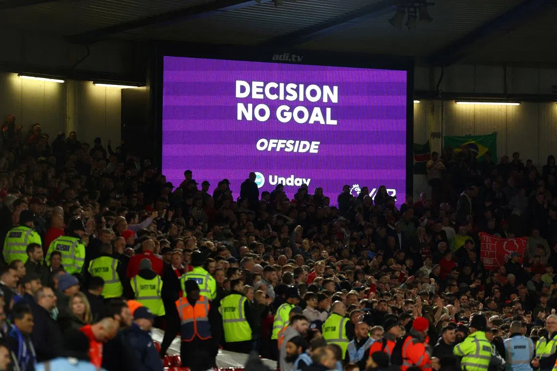 FILE PHOTO: Soccer Football - Premier League - Nottingham Forest v Brighton & Hove Albion - The City Ground, Nottingham, Britain - April 26, 2023 A big screen displays a VAR review message with a no goal for offside REUTERS/Molly Darlington/File Photo