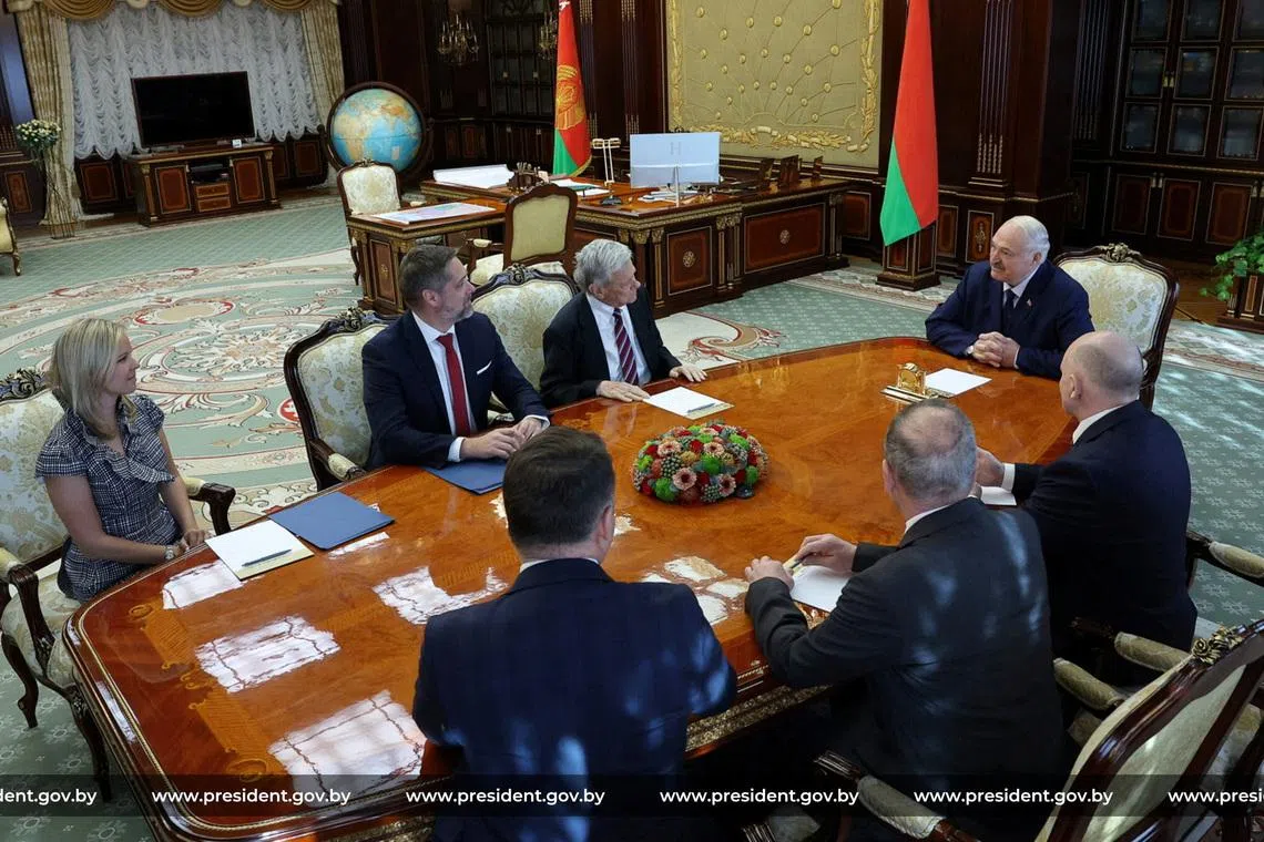 Members of the delegations, led by Belarusian President Alexander Lukashenko and U.S. presidential envoy John Coale, hold talks in Minsk, Belarus, March 19, 2026. President of the Republic of Belarus/Handout via REUTERS