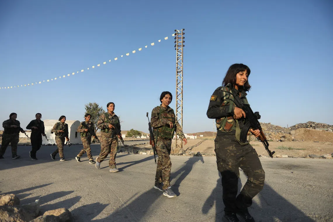 Women fighters from the Women's Protection Units (YPJ) take part in military traning in Hasakah, Syria, August 22, 2026. REUTERS/Orhan Qereman