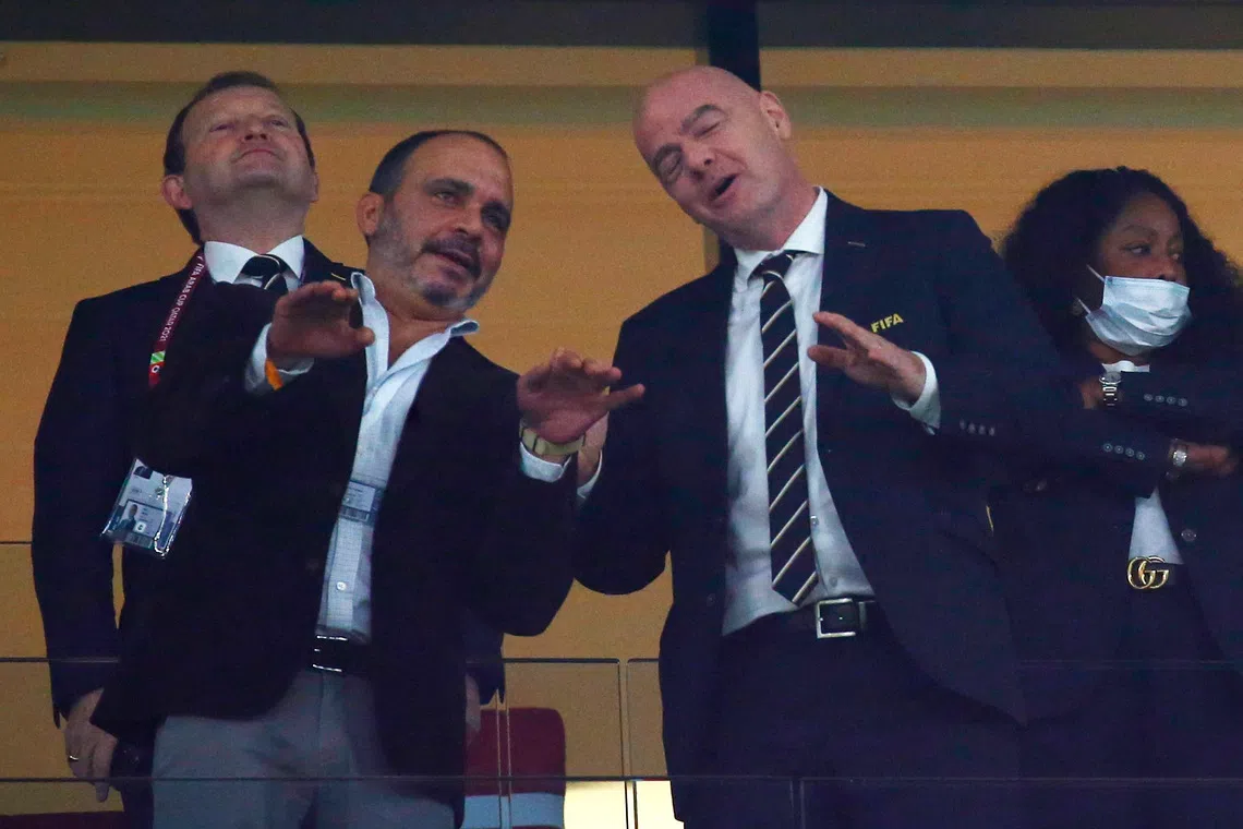 FILE PHOTO: Soccer Football - Arab Cup - Group C - Saudi Arabia v Jordan - Education City Stadium, Al Rayyan, Qatar - December 1, 2021  Prince Ali bin Hussein the President of Jordan football association is seen with FIFA President Gianni Infantino in the stands REUTERS/Amr Abdallah Dalsh/File Photo