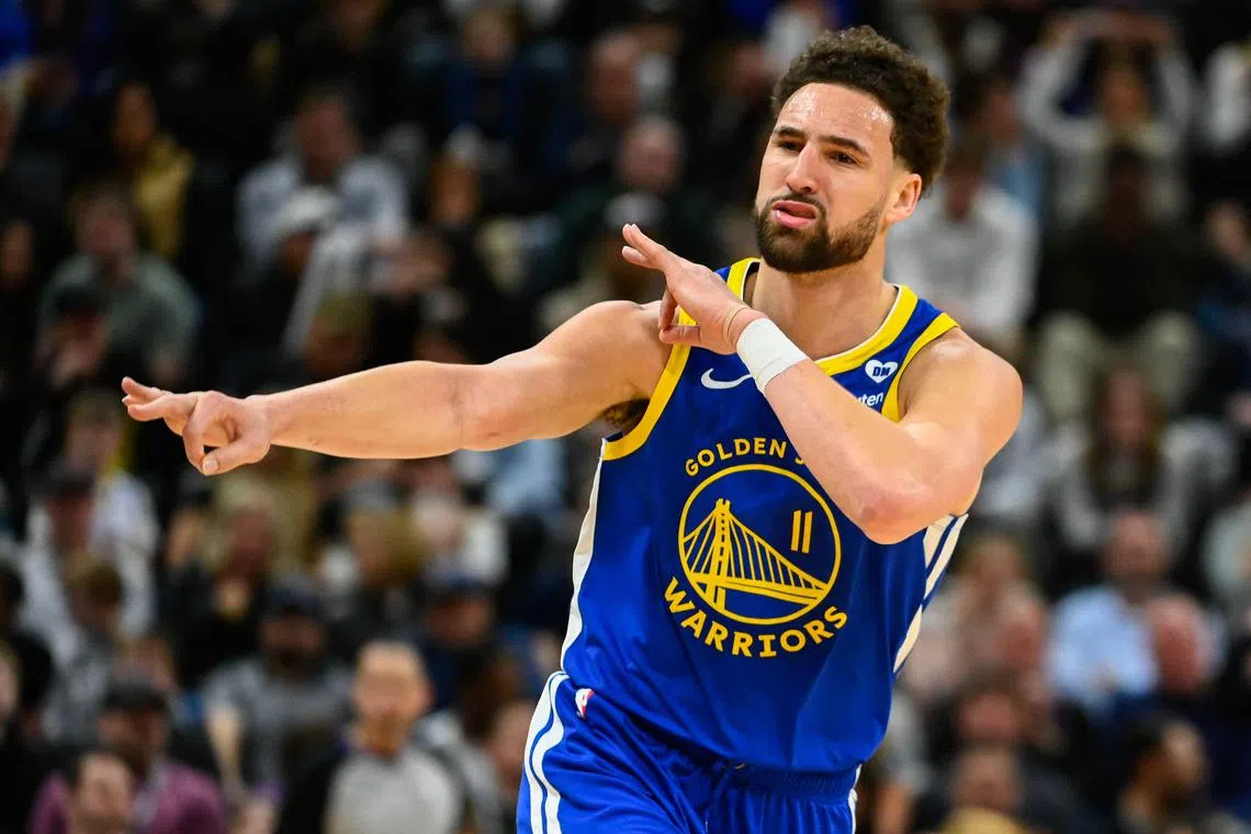 Klay Thompson of the Golden State Warriors celebrating a three-point shot during the second half of a game against the Utah Jazz at Delta Centre on Feb 15. He scored a season-high 35 points off the bench in his team's 140-137 win.