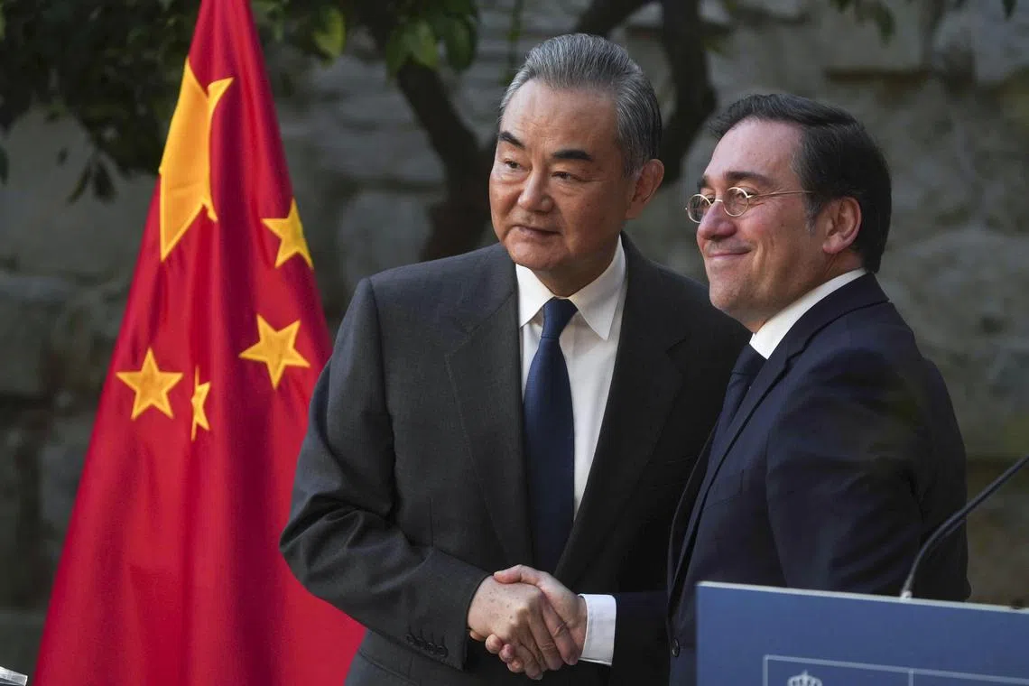 Chinese Foreign Minister Wang Yi (left) and the Spanish Minister of Foreign Affairs, European Union and Cooperation Jose Manuel Albares at a press conference on Feb 18.