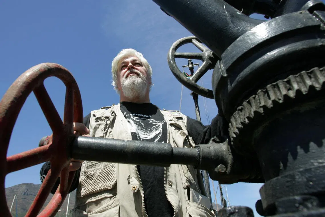 FILE PHOTO: Canadian Paul Watson, the captain of the anti-whaling ship the Farley Mowat, stands on the deck of the boat in Cape Town, South Africa January 30, 2006.  REUTERS/Howard Burditt/File Photo