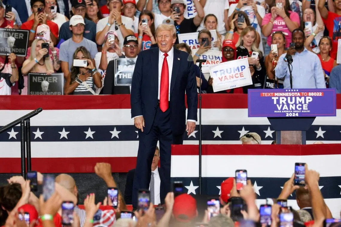TOPSHOT - Former US President and 2024 Republican presidential candidate Donald Trump arrives to speak during a campaign rally at Herb Brooks National Hockey Center in Saint Cloud, Minnesota, on July 27, 2024. (Photo by Alex Wroblewski / AFP)