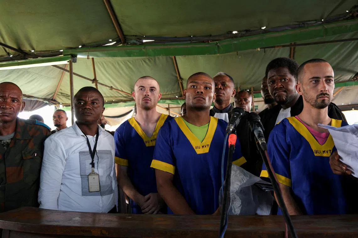 FILE PHOTO: Benjamin Zalman Polun, Marcel Malanga and Taylor Thompson, American citizens suspected, along with a group of over fifty other people, to be involved in an attempted coup in Congo, wait for the beginning of their trial in Kinshasa, Democratic Republic of Congo, June 7, 2024. REUTERS/Justin Makangara/File Photo