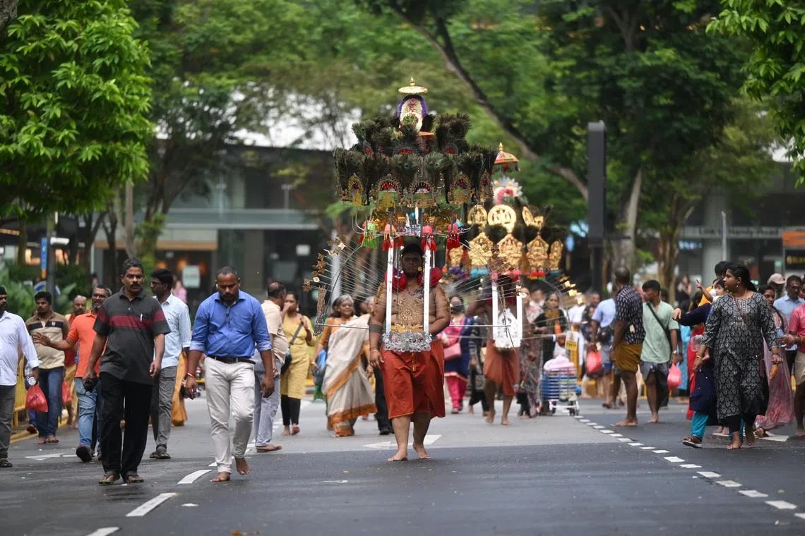 The devotees engaged in penitential acts along a walk of faith for Hindu god Lord Murugan.
