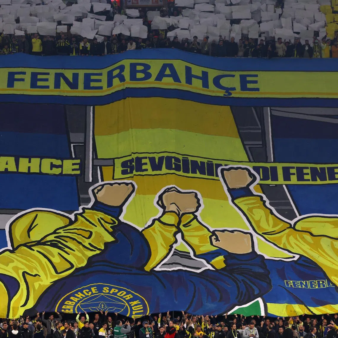 FILE PHOTO: Soccer Football - Super Lig - Fenerbahce v Galatasaray - Sukru Saracoglu Stadium, Istanbul, Turkey - December 1, 2025 Fenerbahce fans display a tifo in the stands before the match REUTERS/Murad Sezer/File Photo