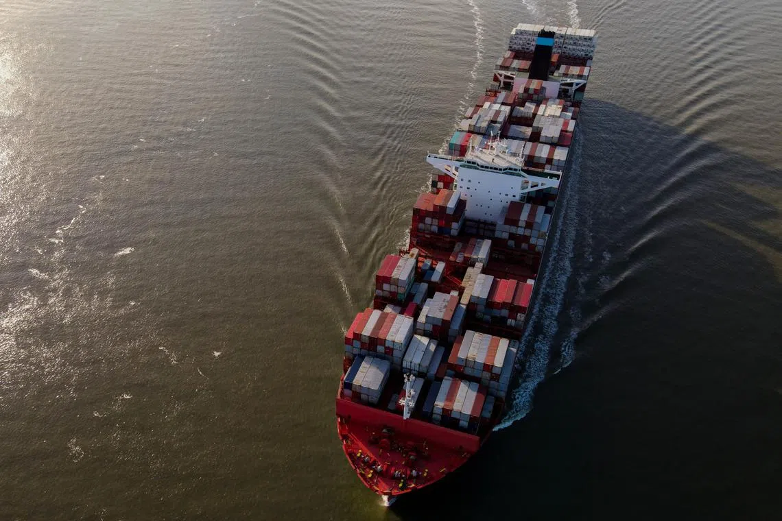 epa11224618 A photo taken with a drone shows the container ship San Nicolas Maersk, registered in Denmark  (IMO 9622203), on its way to Antwerp Harbour, near Hansweert, the Netherlands, 16 March 2024. Antwerp Harbour is the second-largest port in Europe and regarded a major gateway for trade between Europe and other parts of the world.  EPA-EFE/OLIVIER HOSLET