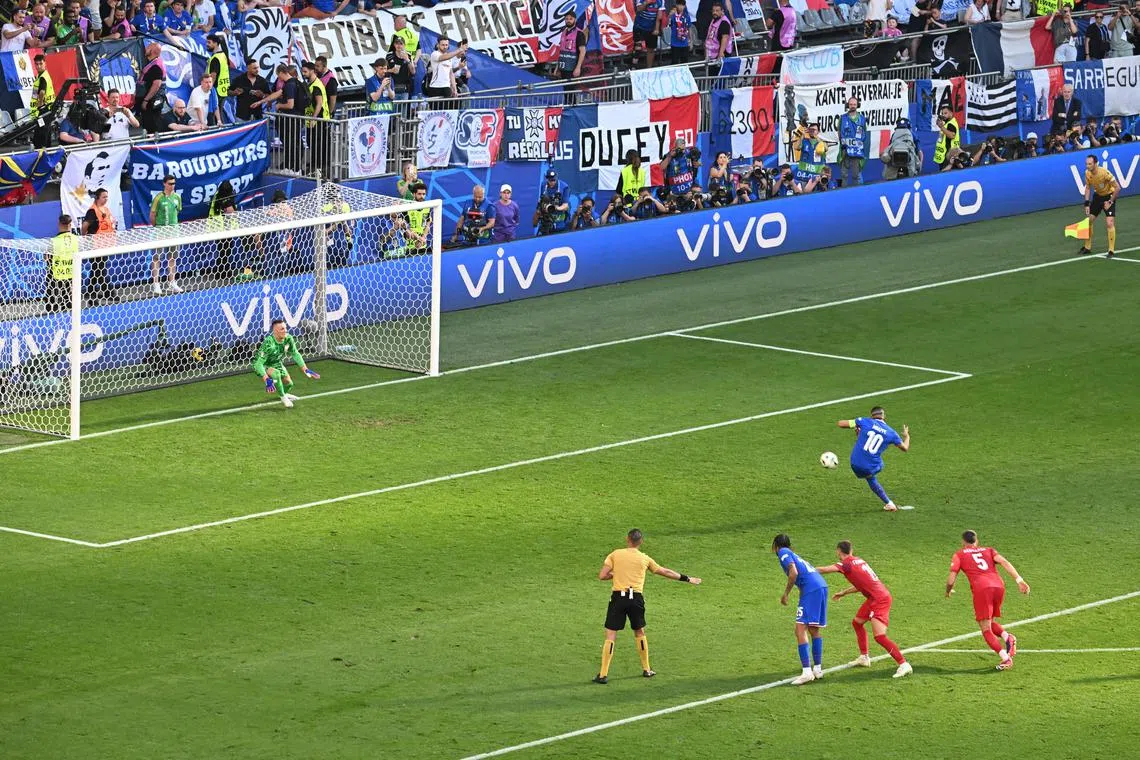France's Kylian Mbappe scores his first-ever goal at the European Championship in the 1-1 draw with Poland.