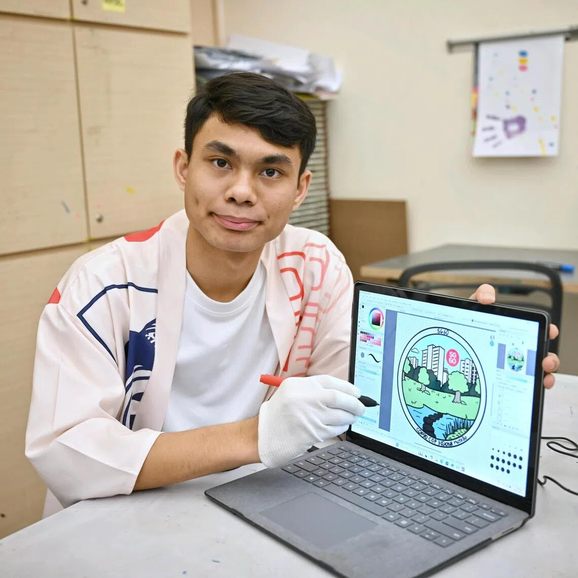 Visual artist Mohammad Zulkhairi Lutfi Mohd Azam says the pin he designed shows a balance between nature and the urban environment.