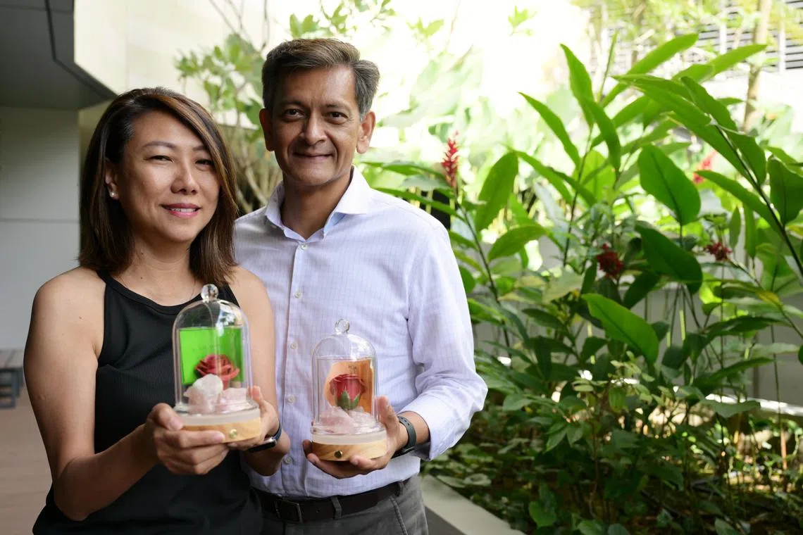 Retiree Lisa Ng, 56, commemorates her late father Simon Ng at Dover Park Hospice?s Rose for Remembrance event where ?memory jars? containing items like rose quartz, a rose, specially-blended scents and handwritten notes are made to evoke cherished memories of departed loved ones. Lisa and her husband board director Mr Aloysius Arlando, 56.