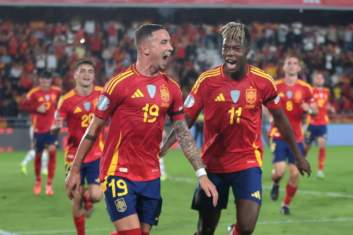 Spain forward Yeremi Pino celebrates with Nico Williams after scoring the first goal in the 3-2 Nations League win over Switzerland.