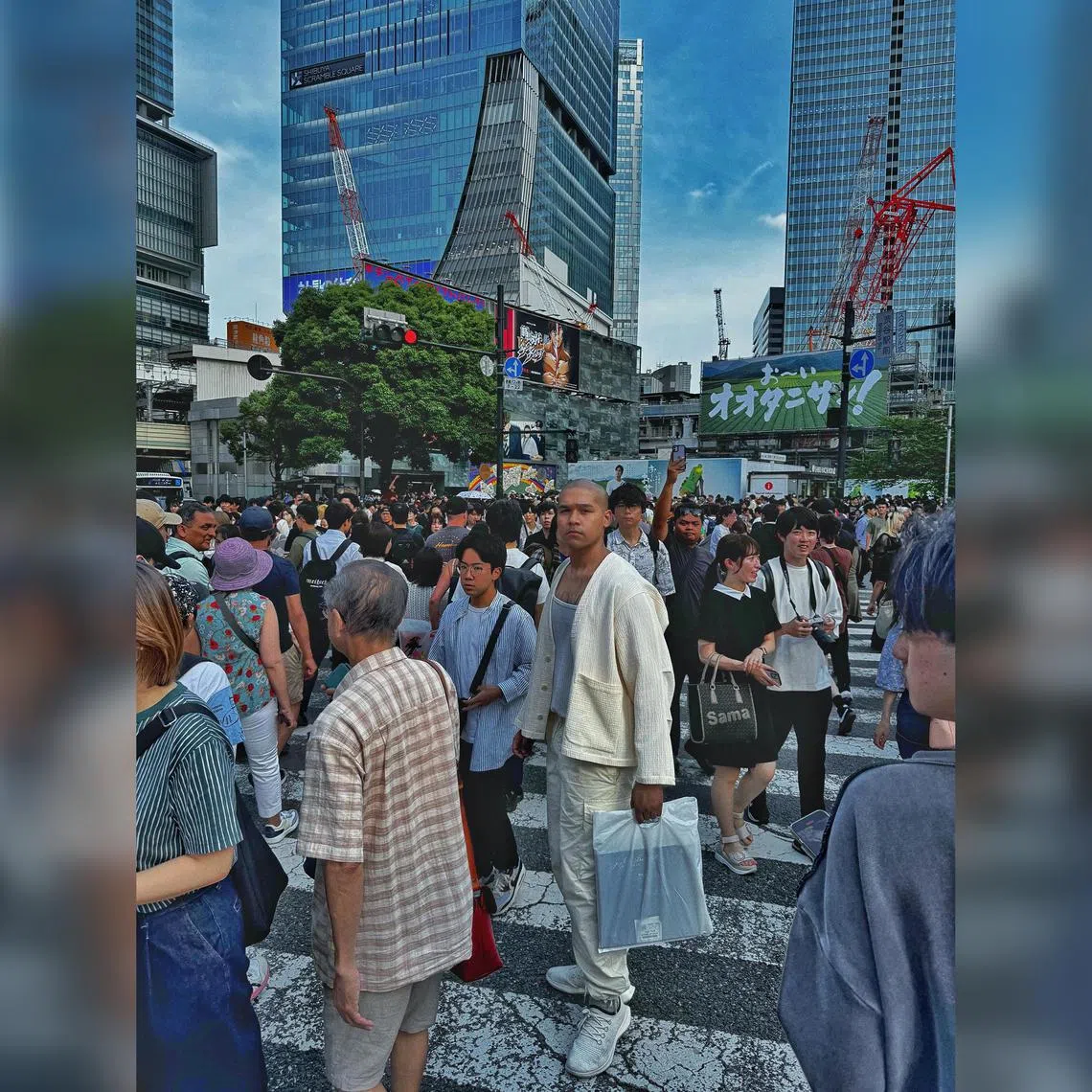 Kiss92 DJ Joshua Simon at the Shibuya Crossing in Tokyo.