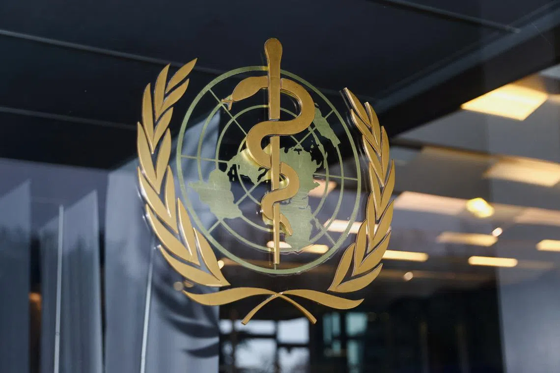 FILE PHOTO: The World Health Organization logo is pictured at the entrance of the WHO building, in Geneva, Switzerland, December 20, 2021. REUTERS/Denis Balibouse/File photo