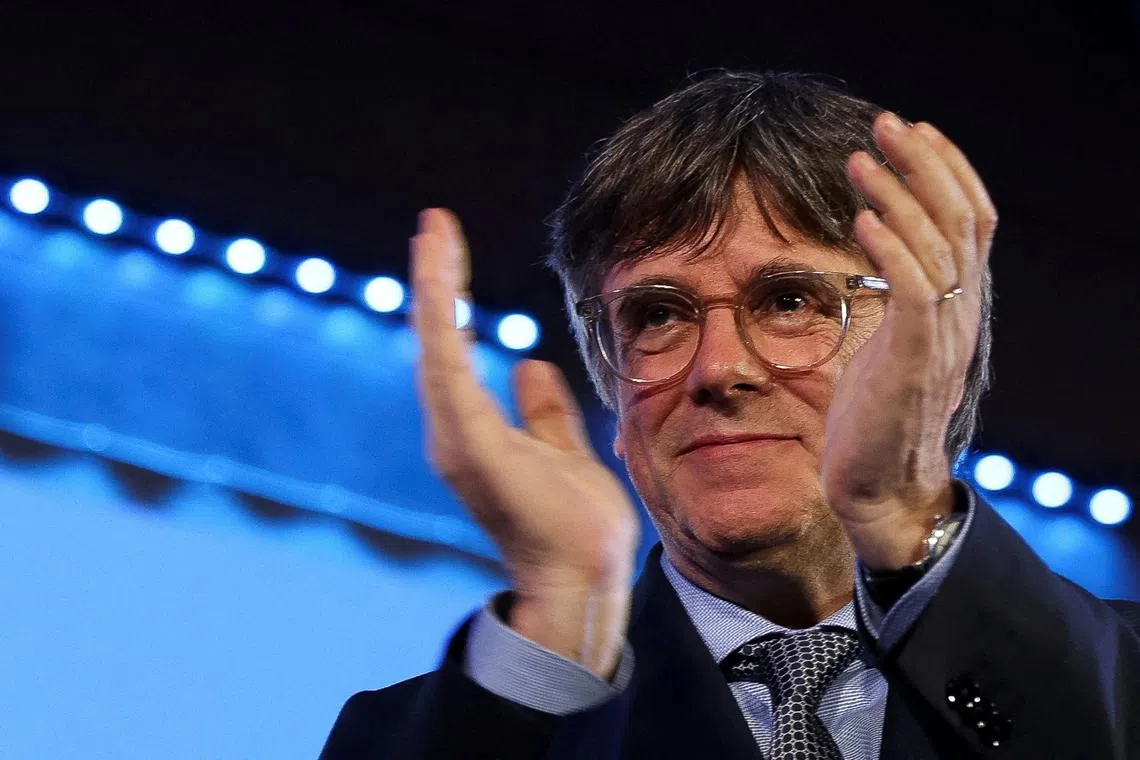 FILE PHOTO: Exiled Catalan separatist leader and Junts Per Catalunya (Together for Catalonia) party candidate Carles Puigdemont applauds on the day of Catalonia's regional elections, in the French town of Argeles-sur-Mer, France, May 12, 2024. REUTERS/Bruna Casas/File Photo