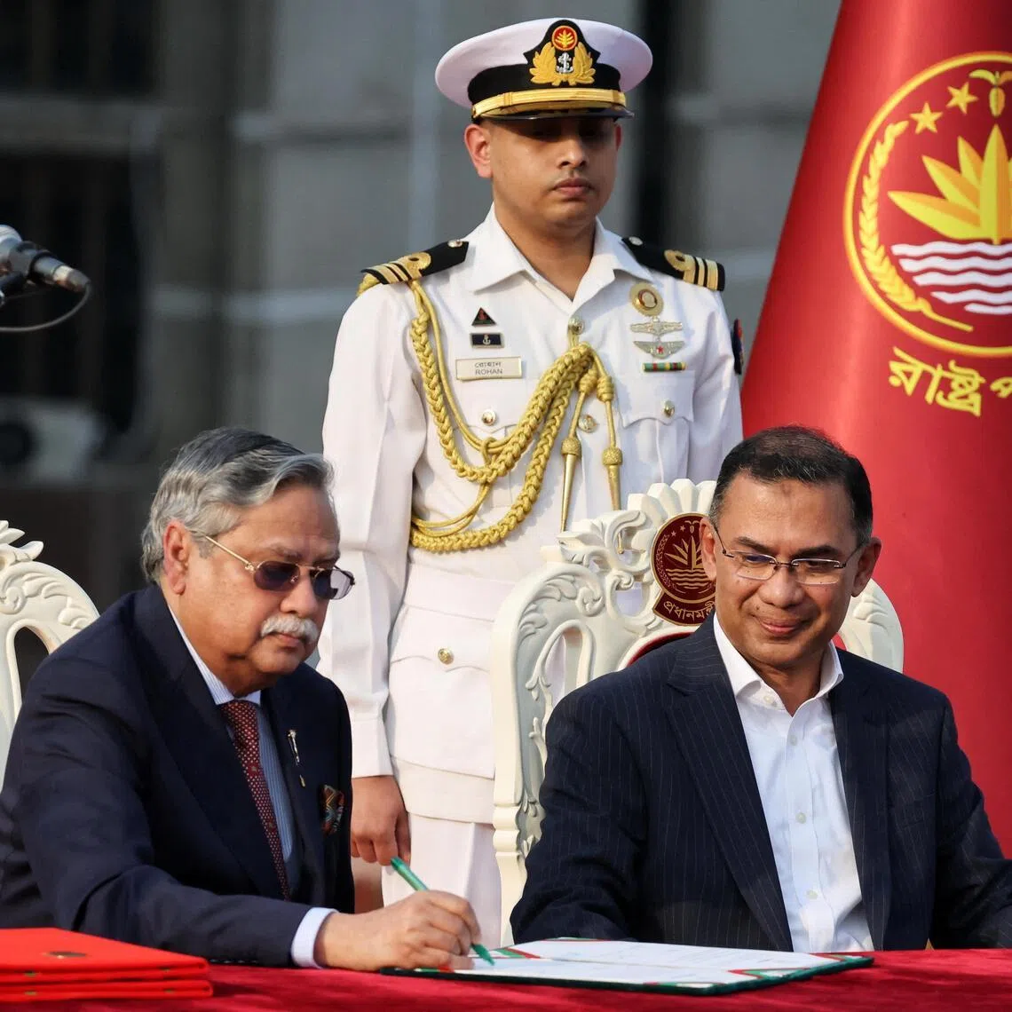 Bangladesh’s President Mohammed Shahabuddin signs as he administers the oath‑taking ceremony for Tarique Rahman as Prime Minister in Dhaka on Feb 17, 2026. PHOTO: REUTERS