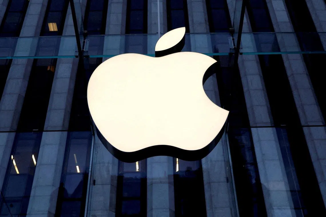 FILE PHOTO: The Apple Inc. logo is seen hanging at the entrance to the Apple store on 5th Avenue in Manhattan, New York, U.S., October 16, 2019. REUTERS/Mike Segar/File Photo
