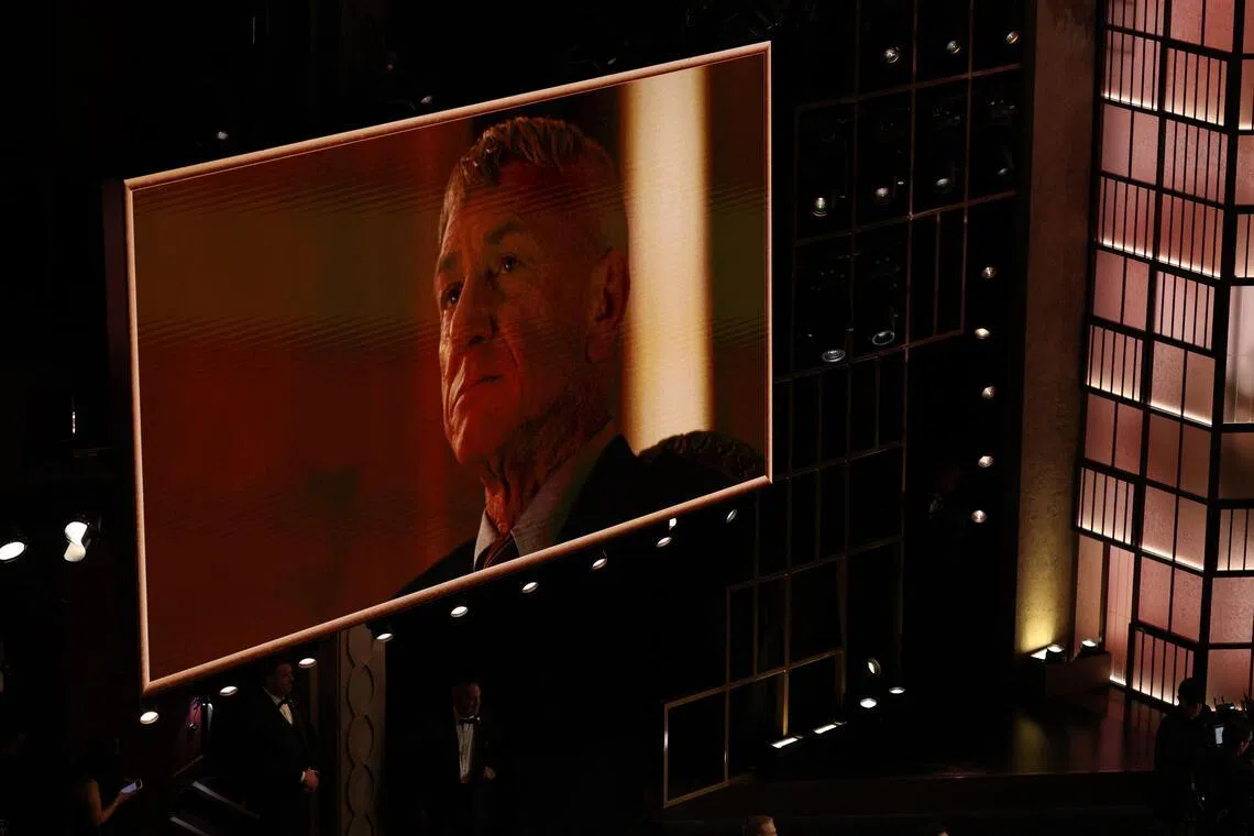 A photo of US actor Sean Penn is shown onstage after he won the Oscar for Best Actor in a Supporting Role for "One Battle After Another" during the 98th Annual Academy Awards at the Dolby Theatre in Hollywood, California on March 15, 2026. (Photo by Patrick T. Fallon / AFP)
